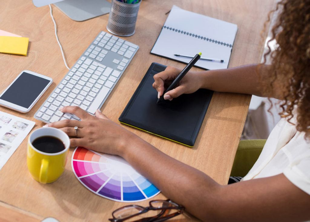 Graphic Designer drawing on tablet